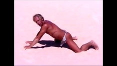 Tanned guy on beach in tiny string thong (temporarily!)